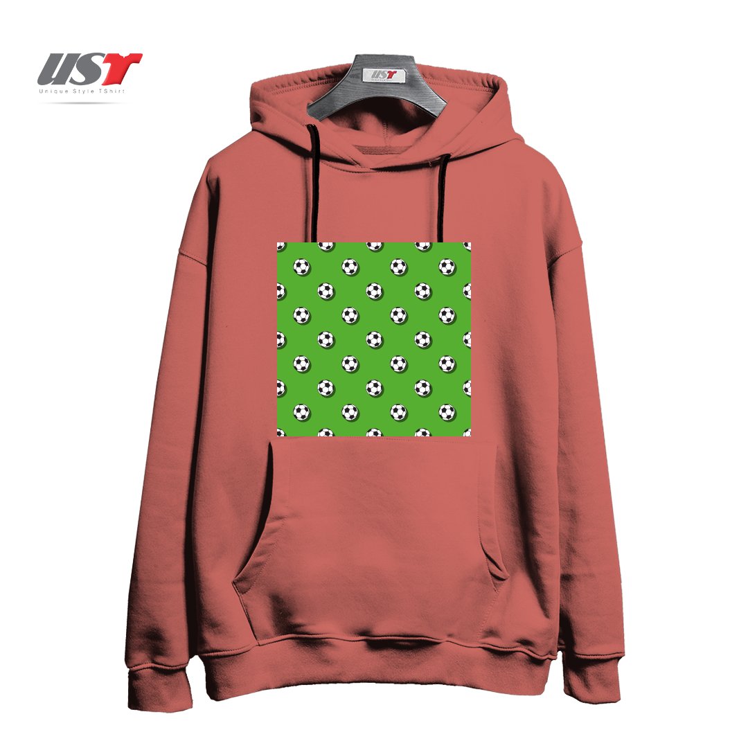 طرح WHITE CLASSIC BALL FOR SOCCER (FOOTBALL) PATTERN ON A GREEN BACKGROUND2 هودی اورسایزرنگ آجری