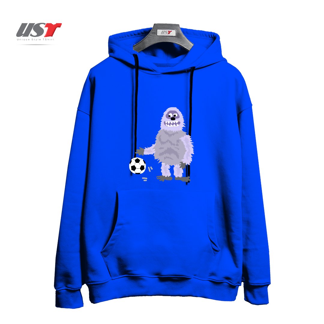 طرح FUNNY ABOMINABLE SNOWMAN PLAYING SOCCER هودی اورسایزرنگ آبی شالی