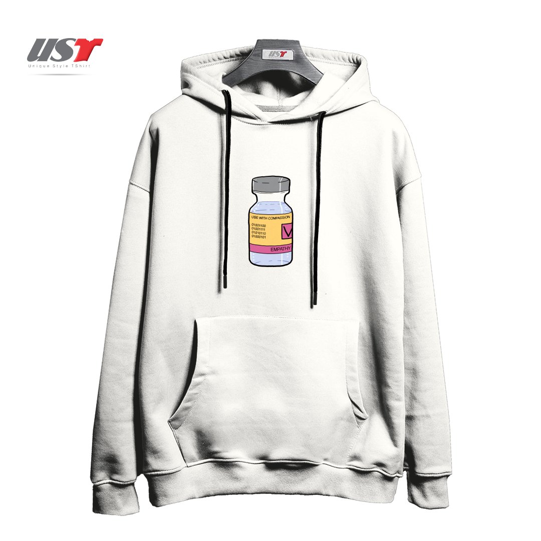 طرح EMPATHY VACCINE - USE WITH COMPASSION هودی اورسایزرنگ سفید